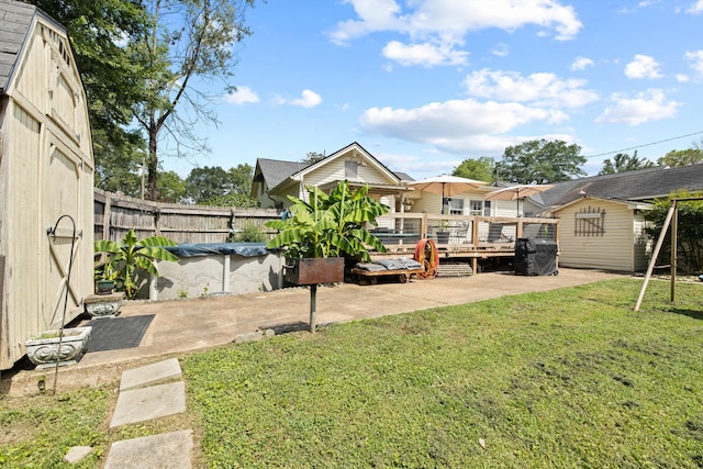 157 Park Ave, Trion, GA 30753 - fenced backyard featuring a wooden deck, a patio area, and a shed