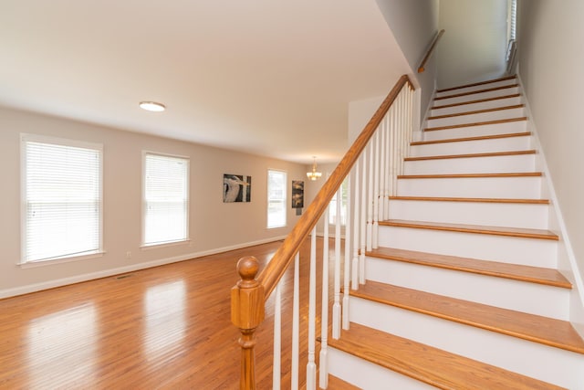 1106 Flynn St, Chattanooga, TN 37403 - stairway with baseboards and wood finished floors