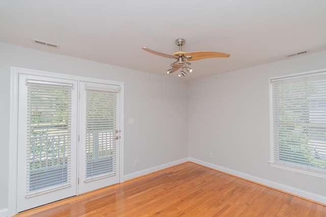 1106 Flynn St, Chattanooga, TN 37403 - empty room featuring light wood-style flooring, ceiling fan, and healthy amount of natural light
