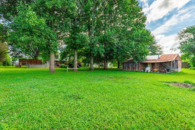 1727 Saunders Rd, Ringgold, GA 30736 - view of grassy yard featuring an outdoor structure