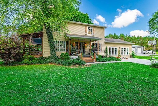 1727 Saunders Rd, Ringgold, GA 30736 - traditional-style home with a front lawn, french doors, concrete driveway, and covered porch