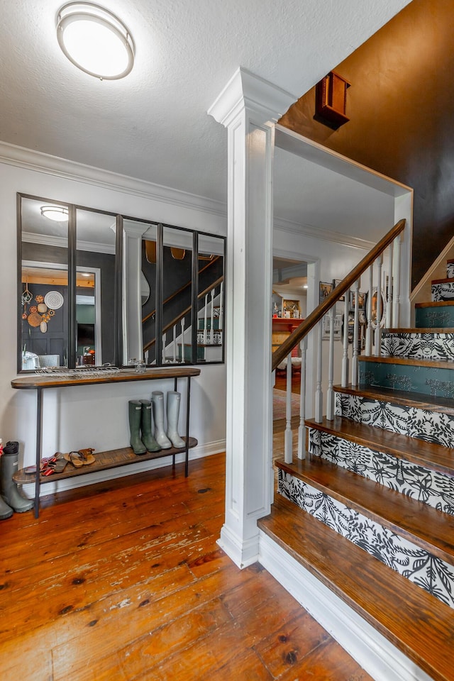1727 Saunders Rd, Ringgold, GA 30736 - staircase with crown molding, hardwood / wood-style flooring, and a textured ceiling