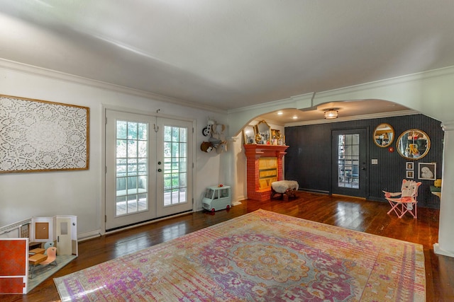 1727 Saunders Rd, Ringgold, GA 30736 - entrance foyer featuring arched walkways, hardwood / wood-style floors, ornamental molding, french doors, and a brick fireplace