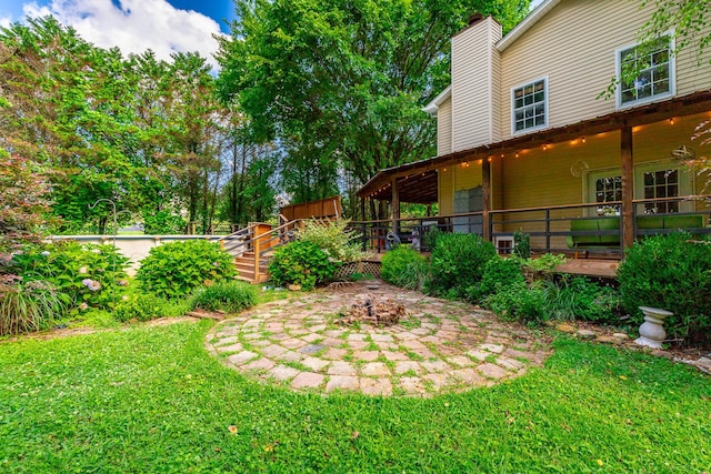 1727 Saunders Rd, Ringgold, GA 30736 - view of green lawn featuring a wooden deck and a patio area