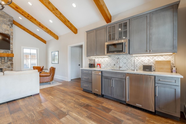 6 Heather Ln, Rising Fawn, GA 30738 - kitchen featuring fridge, stainless steel microwave, gray cabinetry, decorative backsplash, and light countertops