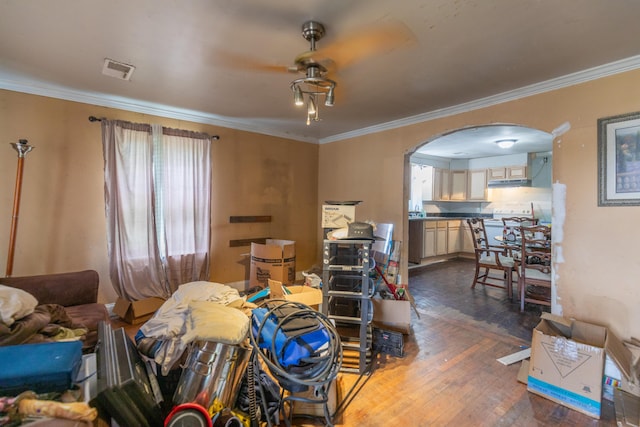1502 E 49th St, Chattanooga, TN 37407 - living area with crown molding, arched walkways, and dark wood finished floors