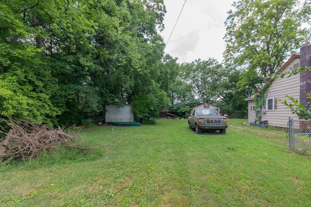 1502 E 49th St, Chattanooga, TN 37407 - view of grassy yard with a storage unit