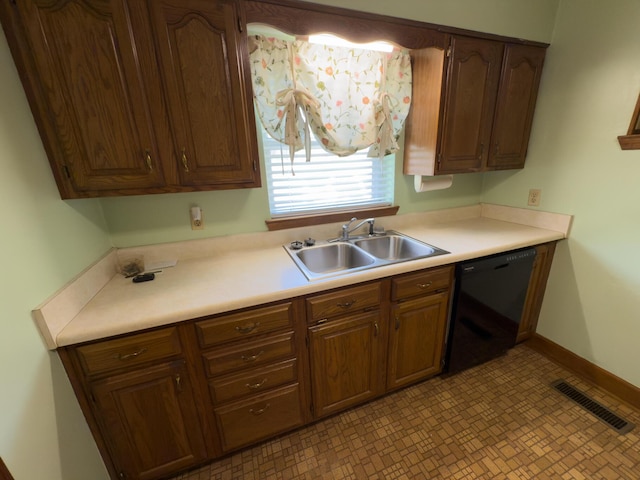 4630 Happy Valley Rd, Flintstone, GA 30725 - kitchen with dishwasher, light countertops, light flooring, and brown cabinetry