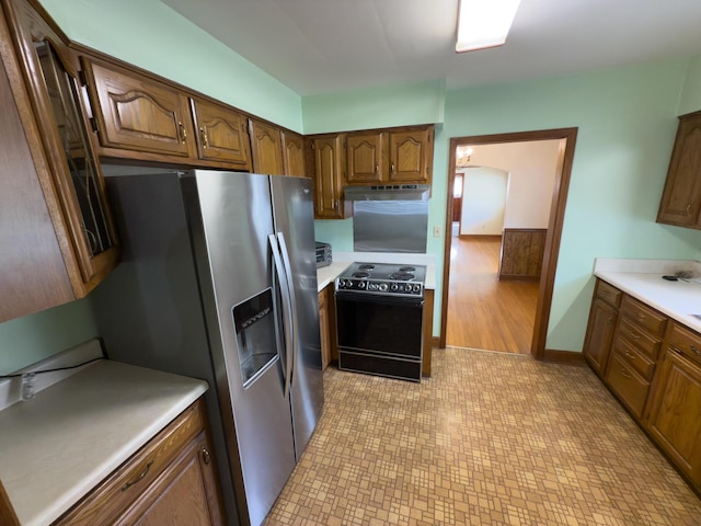 4630 Happy Valley Rd, Flintstone, GA 30725 - kitchen with electric range oven, light floors, stainless steel fridge, under cabinet range hood, and light countertops