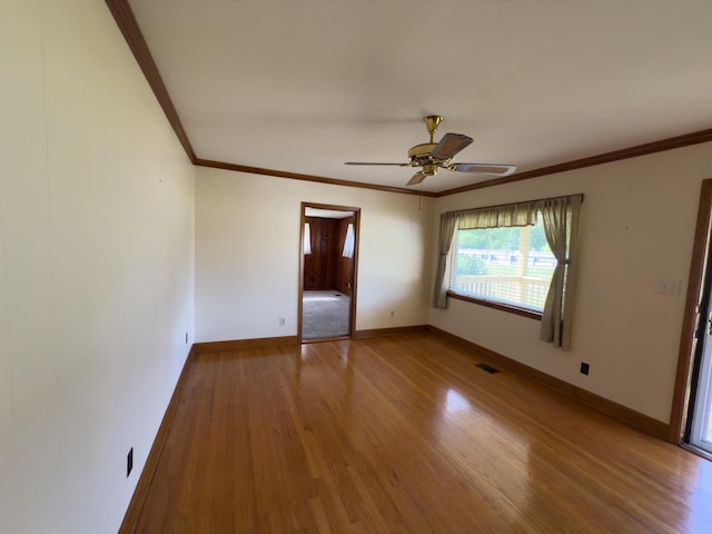 4630 Happy Valley Rd, Flintstone, GA 30725 - empty room featuring wood finished floors, ornamental molding, and a ceiling fan