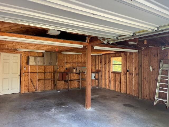 4630 Happy Valley Rd, Flintstone, GA 30725 - garage featuring wooden walls and a garage door opener