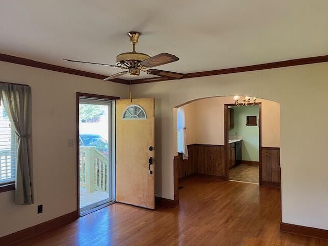 4630 Happy Valley Rd, Flintstone, GA 30725 - entryway with wood finished floors, arched walkways, a ceiling fan, crown molding, and a wainscoted wall