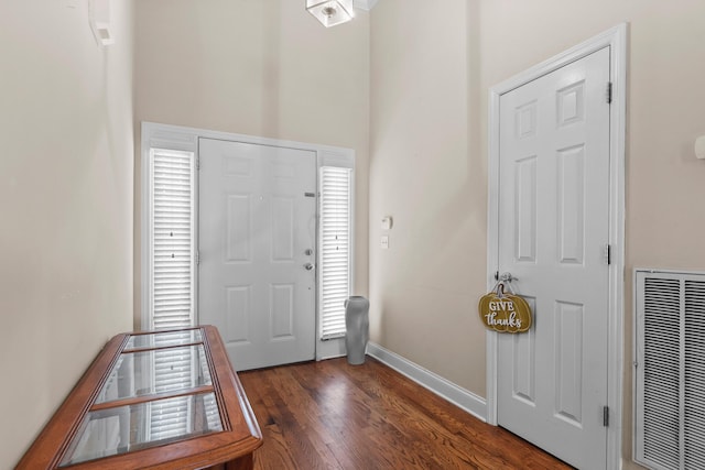 8189 Kaitlin Ln, Ooltewah, TN 37363 - entryway featuring dark wood finished floors, a high ceiling, and a heating unit