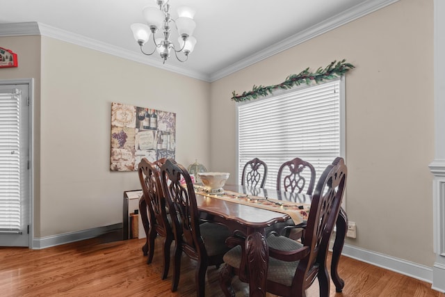 8189 Kaitlin Ln, Ooltewah, TN 37363 - dining space with a chandelier, wood finished floors, and ornamental molding