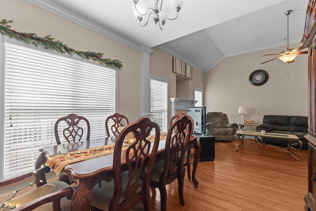 8189 Kaitlin Ln, Ooltewah, TN 37363 - dining area featuring ornamental molding, lofted ceiling, light wood-style flooring, a chandelier, and ceiling fan