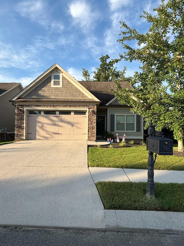 8502 Kennerly Ct, Ooltewah, TN 37363 - view of front facade featuring concrete driveway, a garage, stone siding, and a front yard
