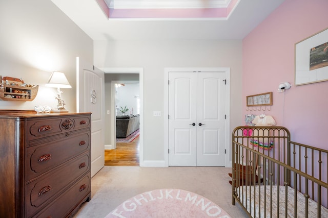 8502 Kennerly Ct, Ooltewah, TN 37363 - bedroom with light carpet, a closet, and a crib