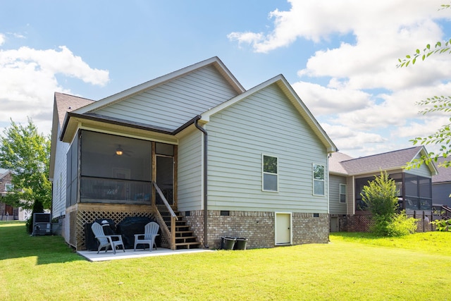 8502 Kennerly Ct, Ooltewah, TN 37363 - back of house with a sunroom, a patio area, a lawn, crawl space, and stairs