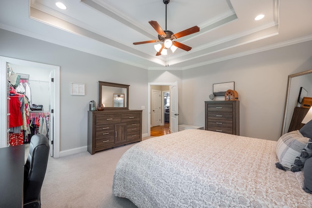 8502 Kennerly Ct, Ooltewah, TN 37363 - bedroom featuring a tray ceiling, ornamental molding, a walk in closet, a closet, and recessed lighting