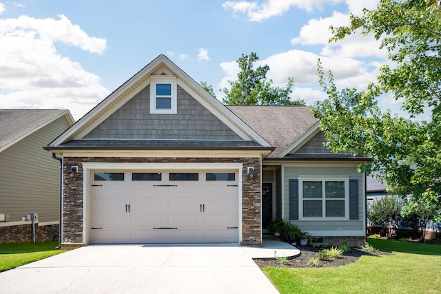 8502 Kennerly Ct, Ooltewah, TN 37363 - craftsman-style home with driveway, a garage, a front yard, and a shingled roof