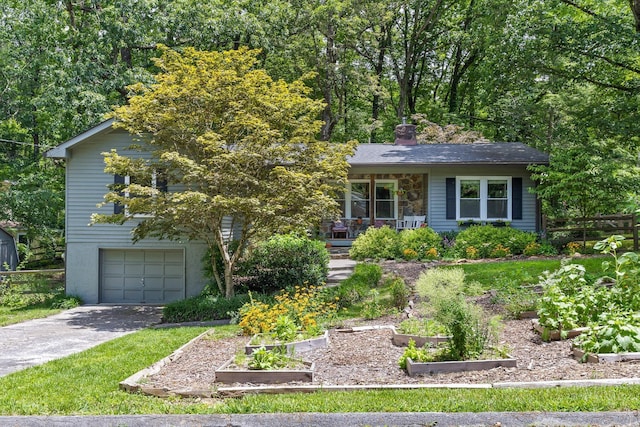 1617 Devlan Forest Ln, Signal Mountain, TN 37377 - view of front facade featuring a vegetable garden, a garage, driveway, a chimney, and a porch