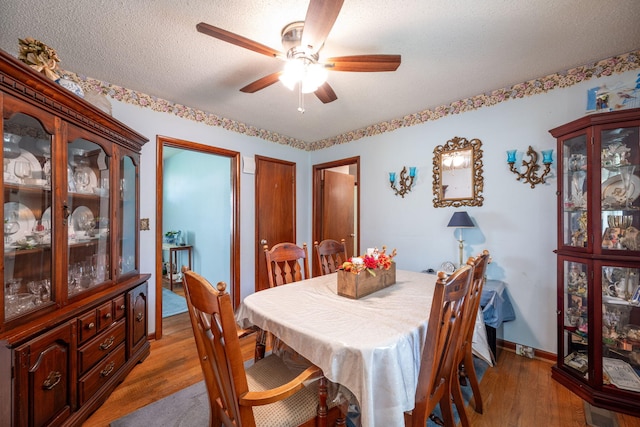 4312 Kemp Dr, Chattanooga, TN 37411 - dining space with light wood finished floors, a ceiling fan, and a textured ceiling