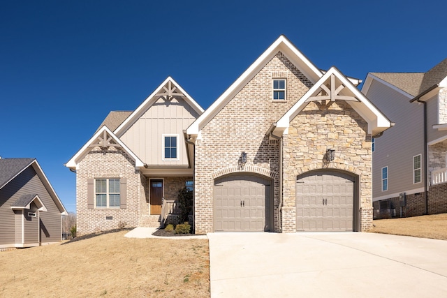 10619 Kavya Ln, Apison, TN 37302 - craftsman-style home with board and batten siding, driveway, an attached garage, brick siding, and crawl space