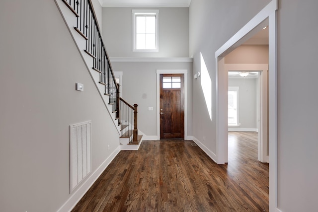 10619 Kavya Ln, Apison, TN 37302 - entryway with dark wood-style flooring, stairs, a towering ceiling, and ceiling fan