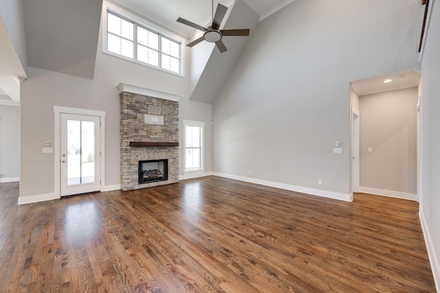 10619 Kavya Ln, Apison, TN 37302 - unfurnished living room with a high ceiling, a ceiling fan, a stone fireplace, and wood finished floors
