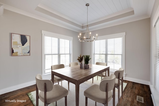 10619 Kavya Ln, Apison, TN 37302 - dining area with a tray ceiling, a chandelier, healthy amount of natural light, dark wood-type flooring, and ornamental molding