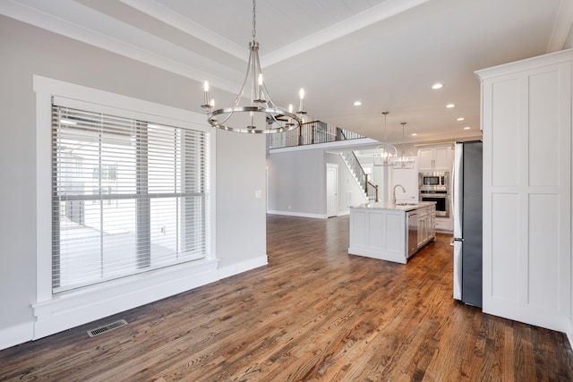 10619 Kavya Ln, Apison, TN 37302 - kitchen with a chandelier, stainless steel appliances, recessed lighting, white cabinets, and dark wood finished floors