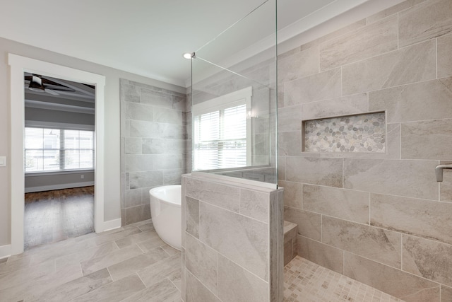 10619 Kavya Ln, Apison, TN 37302 - full bath with walk in shower, a soaking tub, tile walls, and ceiling fan