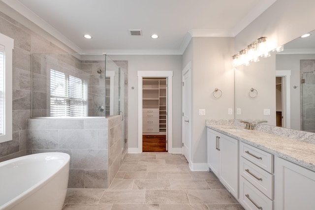10619 Kavya Ln, Apison, TN 37302 - full bath with a walk in closet, vanity, a stall shower, a freestanding bath, and ornamental molding