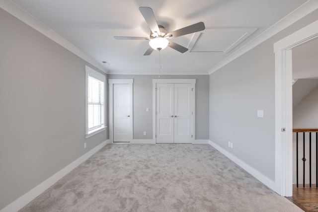 10619 Kavya Ln, Apison, TN 37302 - unfurnished bedroom with attic access, carpet flooring, multiple closets, ceiling fan, and ornamental molding