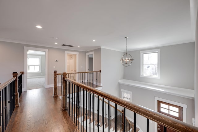 10619 Kavya Ln, Apison, TN 37302 - corridor with an upstairs landing, a chandelier, recessed lighting, dark wood finished floors, and ornamental molding