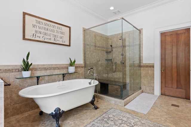 2109 E Brow Rd, Walden, TN 37377 - bathroom with tile walls, a soaking tub, ornamental molding, a shower stall, and tile patterned floors