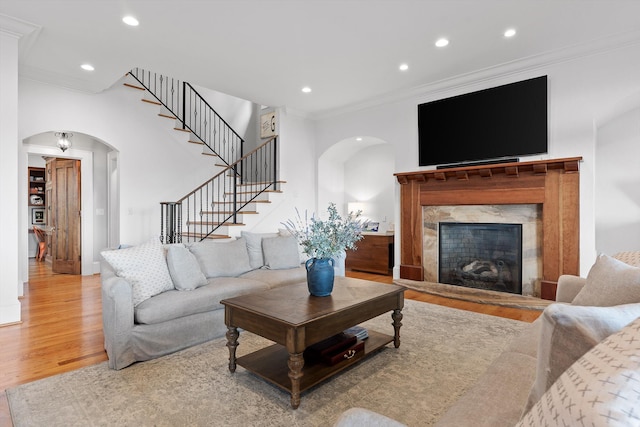 2109 E Brow Rd, Walden, TN 37377 - living room featuring arched walkways, ornamental molding, a fireplace, wood finished floors, and recessed lighting