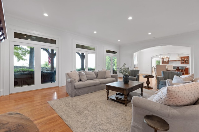 2109 E Brow Rd, Walden, TN 37377 - living area featuring arched walkways, french doors, crown molding, a chandelier, and light wood-style floors