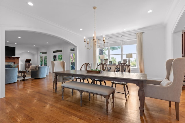 2109 E Brow Rd, Walden, TN 37377 - dining area with arched walkways, wood finished floors, a premium fireplace, recessed lighting, and crown molding