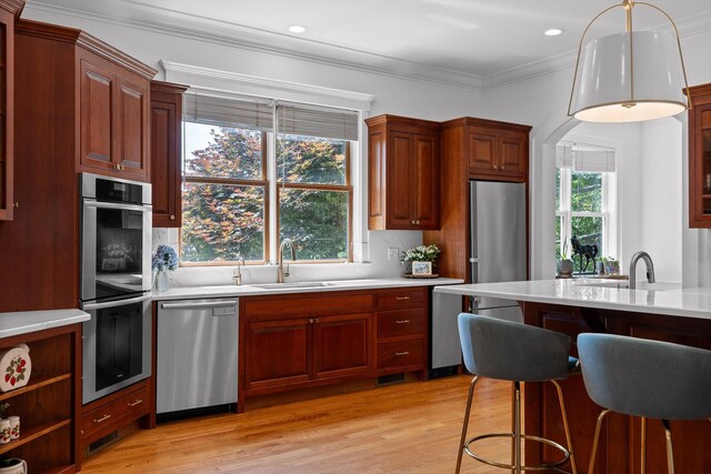 2109 E Brow Rd, Walden, TN 37377 - kitchen with stainless steel appliances, light wood-style floors, pendant lighting, ornamental molding, and tasteful backsplash