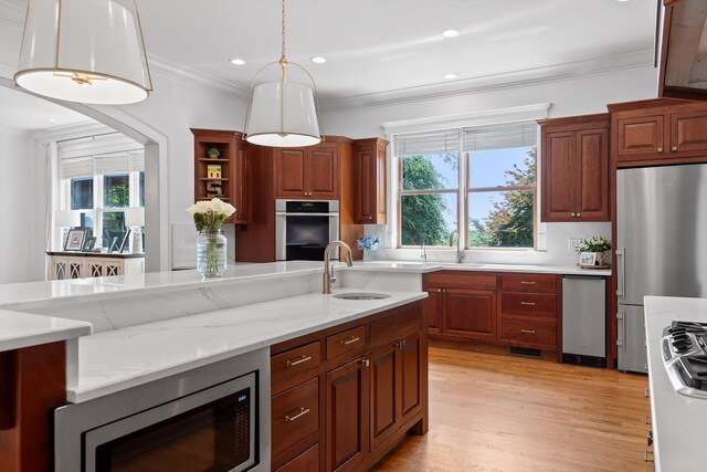 2109 E Brow Rd, Walden, TN 37377 - kitchen with appliances with stainless steel finishes, crown molding, decorative light fixtures, light wood-style floors, and light stone counters