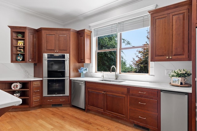 2109 E Brow Rd, Walden, TN 37377 - kitchen featuring open shelves, appliances with stainless steel finishes, light wood-style floors, ornamental molding, and brown cabinets