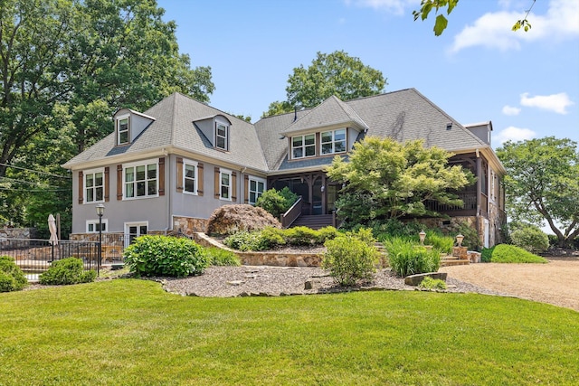 2109 E Brow Rd, Walden, TN 37377 - view of front facade with a sunroom, a front yard, and stone siding