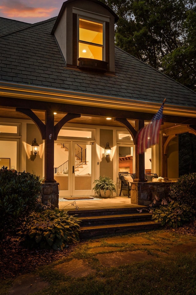 2109 E Brow Rd, Walden, TN 37377 - back of house at dusk with stucco siding, a high end roof, and covered porch