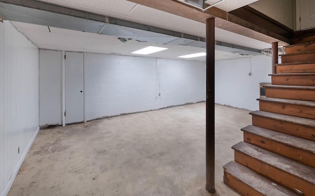 4702 Eldridge Rd, Hixson, TN 37343 - below grade area with stairway, concrete block wall, and a paneled ceiling