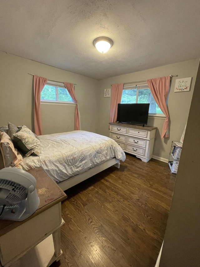 4702 Eldridge Rd, Hixson, TN 37343 - bedroom with dark wood finished floors and a textured ceiling