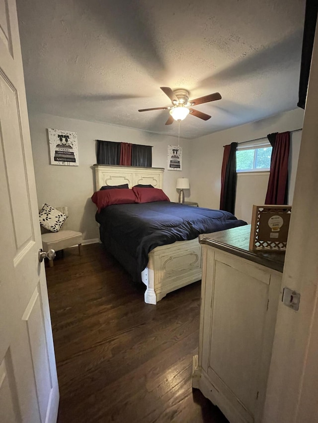4702 Eldridge Rd, Hixson, TN 37343 - bedroom with dark wood finished floors, a textured ceiling, and a ceiling fan