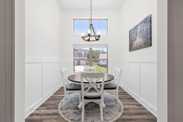 6859 Steep Hl, Ooltewah, TN 37363 - dining area with a chandelier, a decorative wall, wainscoting, and dark wood finished floors
