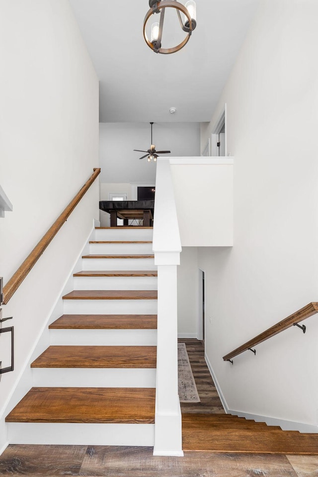 6859 Steep Hl, Ooltewah, TN 37363 - stairs featuring wood finished floors, a ceiling fan, and a chandelier