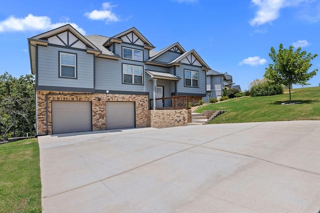 6859 Steep Hl, Ooltewah, TN 37363 - view of front of house featuring a garage, brick siding, a front yard, and driveway